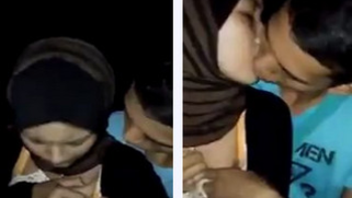 Shy girl in hijab and boyfriend develop kissing skills on camera