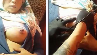 Piercer takes care of Arab girl's nipples in amateur XXX video
