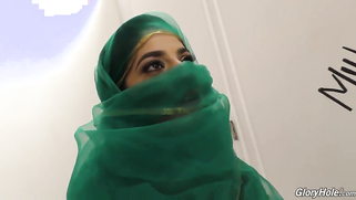 Arab lovely in green hijab finds gloryhole room in a sex shop | XXX Video on AllSex.XXX