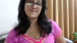 Amateur XXX show of nerdy Paki webcam model in a purple dress