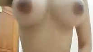 Chudai video of naked Indian gal shaking juicy XXX jugs in bathroom