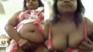 Chubby Desi woman performs solo strip XXX show in front of camera