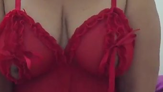 Indian woman exposes boobs in red nightgown filming porn for XVideos