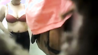 Indian woman with big XXX tits changes clothes not noticing camera