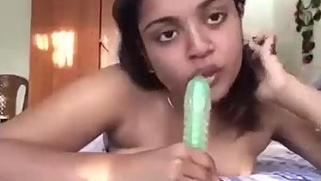 Solo chudai video of young Indian angel carefully sucking XXX dildo