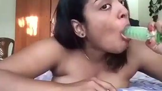 Naked Desi sweetheart seductively sucks XXX toy in front of camera