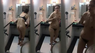 Nerdy Desi woman washes her XXX curves in shower not noticing camera