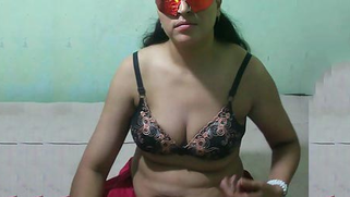 Masked Desi MILF demonstrates on cam her XXX breasts and round booty