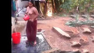 Obese BBW desi aunty nude while bathing outdoors in the garden