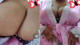 Indian MILF looks into the camera showing that she has XXX boobs