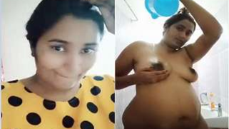 Amateur Desi porn actress shows off XXX boobies and huge belly