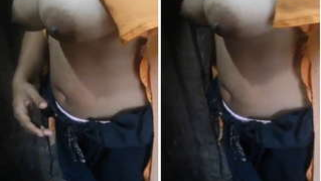 Indian woman looks XXX with her pulled up T-shirt uncovering big tits