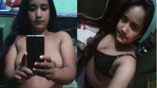 Sweet Indian sexpot provocatively touches juicy XXX boobs at home