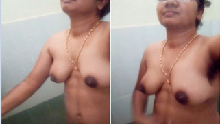 Natural Indian woman with XXX glasses stays fully naked in the shower