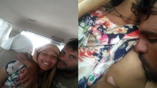 Bearded lad kisses Indian girlfriend's nipple in the backseat