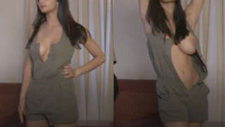 Desi chick in obscene sex clothes poses displaying her breasts