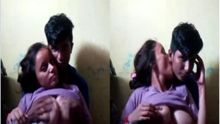 Voluptuous Desi female looks in sex camera while man touches her XXX jugs