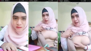 Malay girl in a pink hijab exposes her XXX boobies for online friend