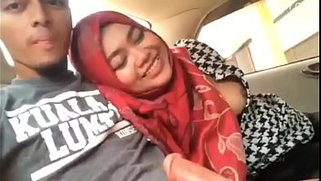 Melayu XXX wife in red hijab sucks husband's instrument in a moving car