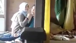 XXX Melayu voyeur films woman in hijab hugging her lover on the floor
