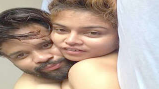 Female from India lies in bed with sex admirer with naked XXX boobs