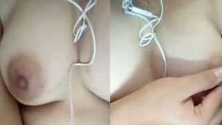 Indian holds a sex camera and touches her own XXX jugs and shaved slit