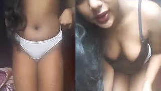 Desi girl poses half-naked and sucks a sex toy in XXX webcam private show