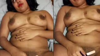 MILF performs a XXX show with a small sex toy pressed to her pussy