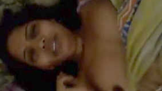 Indian lies in bed and demonstrates her XXX breasts on sex camera