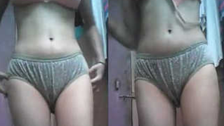 Skinny Desi sets the camera and starts her XXX striptease sex show