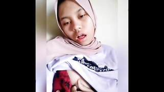 Girl with Malay features doesn't take hijab off but flashes sex parts