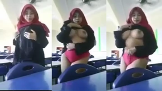 Big busty Malay MILF in a jilbab strips for the XXX cam