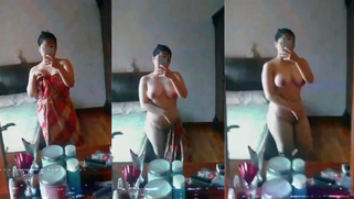 Naked In mirror selfie of a beautiful busty babe in a jilbab from Malay