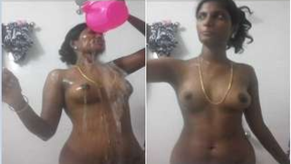 Slender Desi girl gladly pours water all over her perky XXX boobs