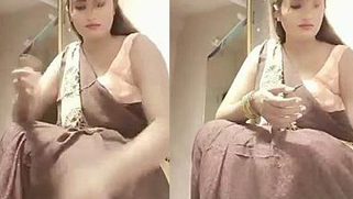 Beautiful Desi MILF shows her XXX assets while putting on clothes