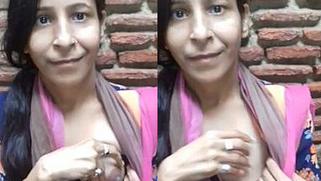 Adorable Desi cutie flashes curious friend her XXX tits in public