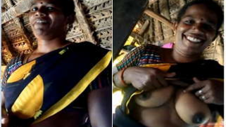 Joyful Desi woman sneakily shows lover her XXX breasts inside barn