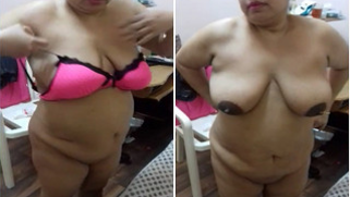 Fat Indian woman changes clothes and accidentally takes part in porn