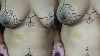 Indian lady lets enjoy her nude inked boobs and nipples in porn chat