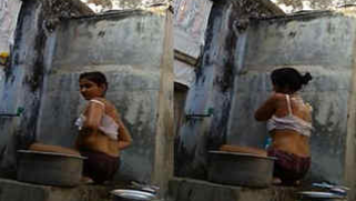 Desi chick puts her sex legs in water performing a XXX washing show