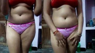 Desi girl in red bra and pink panties shows sexy XXX fruits on camera