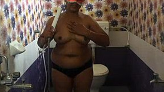 Confused Indian MILF wears a mask because hubby films her porn assets
