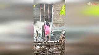 Guy can't take eyes off hot Desi MILF in slinky red dress washing