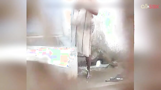 Desi woman flashes big natural breasts while washing the body outside