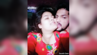 Desi girl in red sari kisses bearded man who films their lips merging