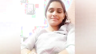 Young woman smiles on camera and changes clothes in sex video show | XXX Video on AllSex.XXX