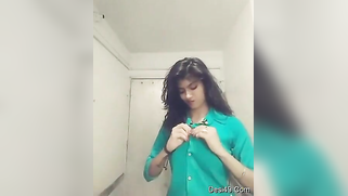 Indian teen unbuttons green shirt and takes it off just like her bra