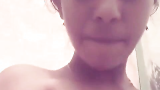 Shower room is a place where the young Desi porn model squeezes tits