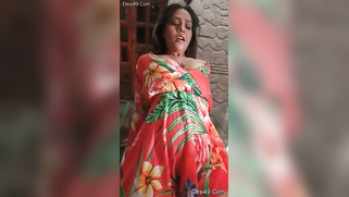 Staggering Desi porn girl in floral dress climbs the glass table