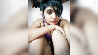 Pretty brunette spreads legs wide to XXX finger her wet Desi cunt